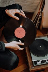 person holding vinyl record